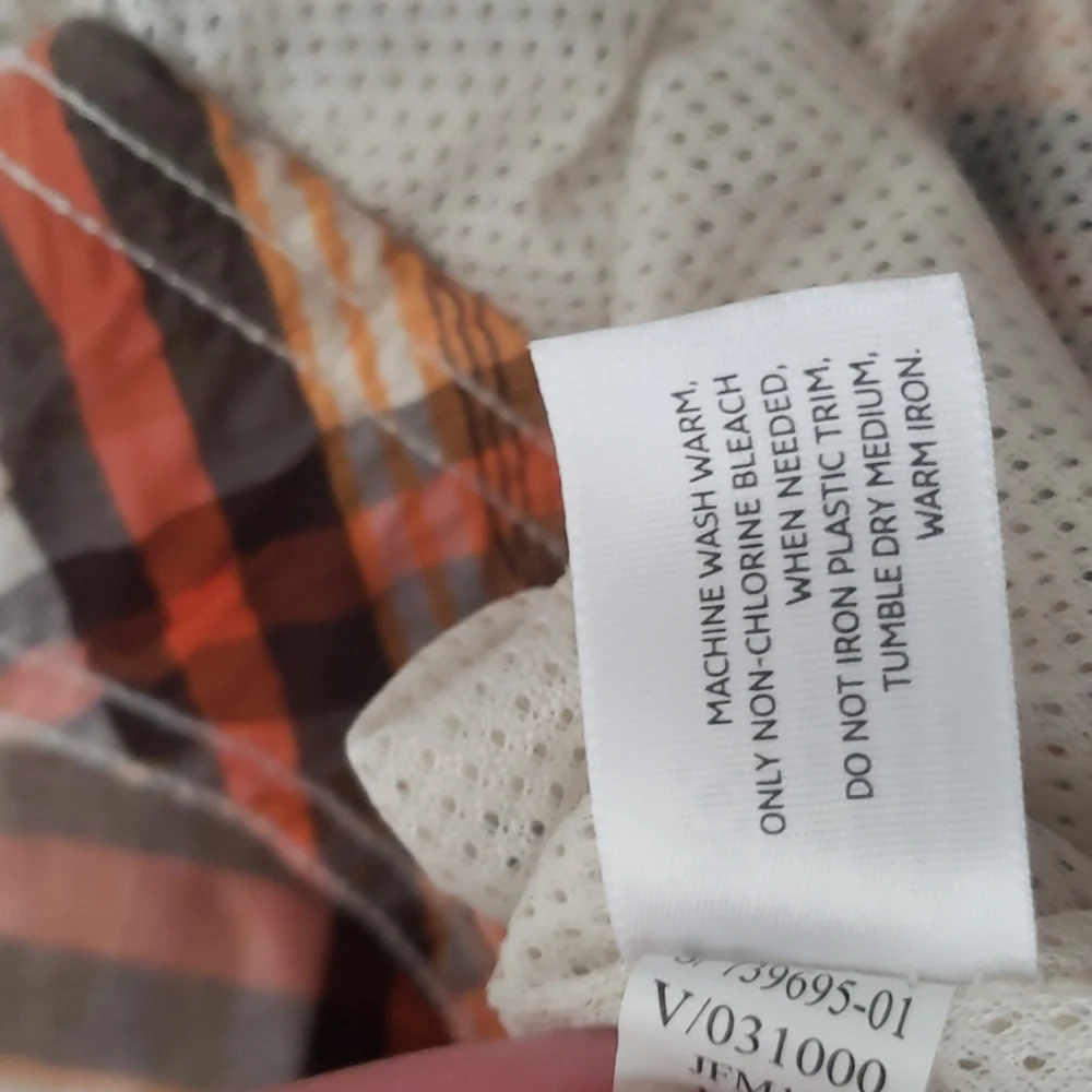 Old Navy plaid swim shorts tan, orange, brown. Pockets, built in brief. Size XXL